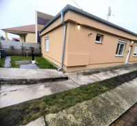 A family house in Ohrady with an outdoor courtyard, walkway, and insulated facade.