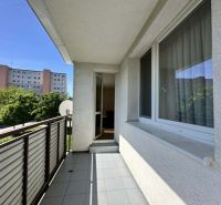 Balcony of a 3-room apartment on the street in Šamorín with a view of greenery.