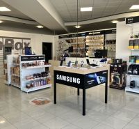 Retail spaces with electronics, cosmetics, and coffee, wooden decor flooring.