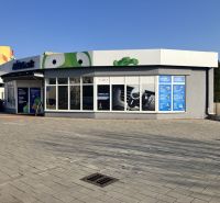 Commercial premises in Dunajská Streda with a modern exterior and large glass display windows.
