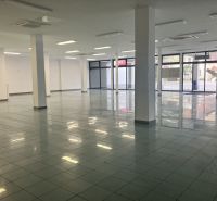 Spacious commercial spaces with glass doors and tiles.