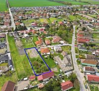 Aerial view of a plot suitable for living in Horná Potôň, surrounded by houses and gardens.