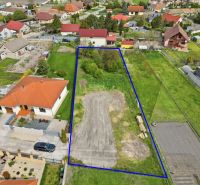 Plots - housing in Horná Potôň with a marked parcel, surrounded by family houses.