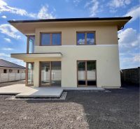 A family house on GARDENTOWN street in Dunajská Streda with a terrace and large windows.