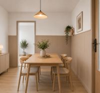 Dining room in a 3-room apartment with a wooden decor floor, a wooden table, and plants.