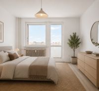 Bedroom in a 3-room apartment with a bed, dresser, and decorative plants.