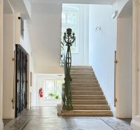 A staircase with a railing in a 3-room apartment on Leškova Street in Bratislava.