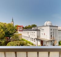 View from a 2-room apartment on Moyzesova Street in Senec with surroundings and trees.