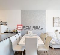 Kitchen and dining area in a 2-room apartment with a floor in wood decor.