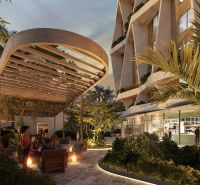 Construction of apartments on Paje Street in Unguja South with illuminated outdoor seating and greenery.