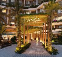 Apartment construction in Paje, Unguja South, illuminated entrance gates surrounded by greenery.