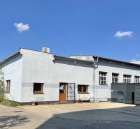 Exterior of office spaces in Žilina, a building with a white facade and windows.