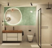 A bathroom with a round mirror, green tiles, and a shower in a 2-room apartment.
