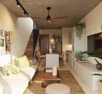 Living room in a two-room apartment with a comfortable sofa and decorative elements on the wall.