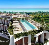 A building with a pool and sea view under construction of apartments in Paje, Unguja South.