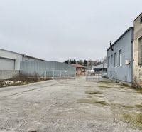Industrial yard with buildings and a fence in the exterior of Žilina, offices.