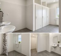 Modern sanitary facilities with sinks, showers, and toilets in warehouses and halls.