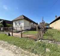 A family house on Tehelná Street in Drienov with a grassy yard and a fence.