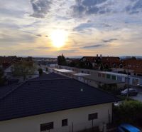 A view of Gagarinova Street in Senec from a 2-room apartment at sunset.