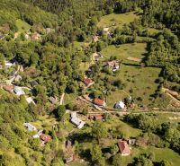 Aerial view of the settlement and houses in the wooded hills of Banky, Banky streets.