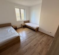 A children's room in a 3-room apartment with beds and a wooden decor floor.