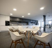 Offices with modern furniture and a kitchenette, a pleasant environment for employees.