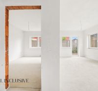 A spacious room in a 3-room apartment with large windows and an open passage.