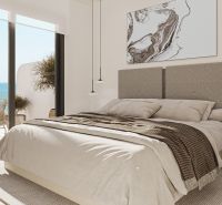 Bedroom in a 2-room apartment with a sea view, neutral colors, modern furniture.