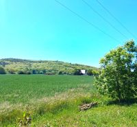 Záhorce offer residential plots with green meadows and views of wooded hills.