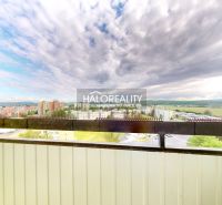 View from the balcony of a 2-room apartment in Lučenec with a panorama of the city and the sky.