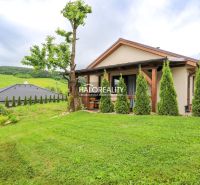 A family house in Dohňany with a landscaped garden, terrace, and views of the surrounding countryside.