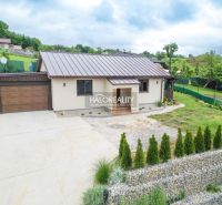 A family house in Dohňany with a garage, garden, and a paved access area.