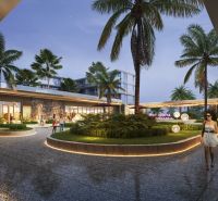 Outside the apartment construction in Phuket, palm trees and illuminated pathways can be seen.