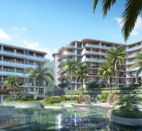 Apartment construction with a pool and palm trees in the city of Phuket.