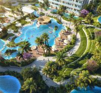 Apartment construction in Phuket with pools amidst greenery and palm trees.