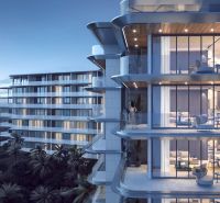 Apartment construction in Phuket with balconies overlooking the beach and sea.