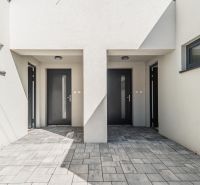 Entrance to the family house on Kľukatá Street, Bratislava - Prievoz, with stone paving.