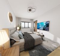 A bedroom in a family house with a wooden decor floor, a large window, and a television.