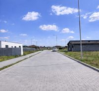 A peaceful street with new residential buildings in Dvory nad Žitavou.