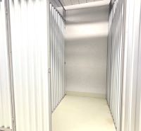 A metal storage space with white walls in a 2-room apartment.