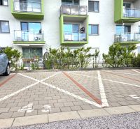 Parking lot in front of the residential building on Jurská Street, Bratislava - Nové Mesto.