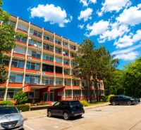 Apartment building on Vlčie Hrdlo in Bratislava - Ružinov with parking and greenery.