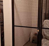 Wire lockable storage spaces in a 2-room apartment.