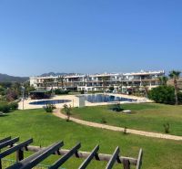 Complex of 2-bedroom apartments in Tatlisu with a swimming pool and well-maintained gardens.