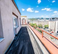 A balcony with a view of Krížna Street in Bratislava - Staré Mesto, at a 2-room apartment.