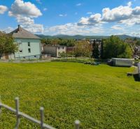 Gardens in Horná Ves, designated for residential plots, surrounded by rural architecture and greenery.