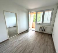 A 2-room apartment with a wooden decor floor and access to a balcony.