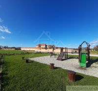A children's playground near the cottage in Holíč, with an architectural monument in the background.