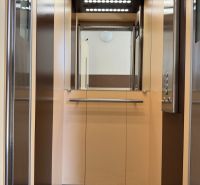 Interior of an elevator with lighting and a mirror in a 3-room apartment.