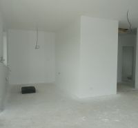 Interior of a family house with an empty room and preparation for electrical installation.